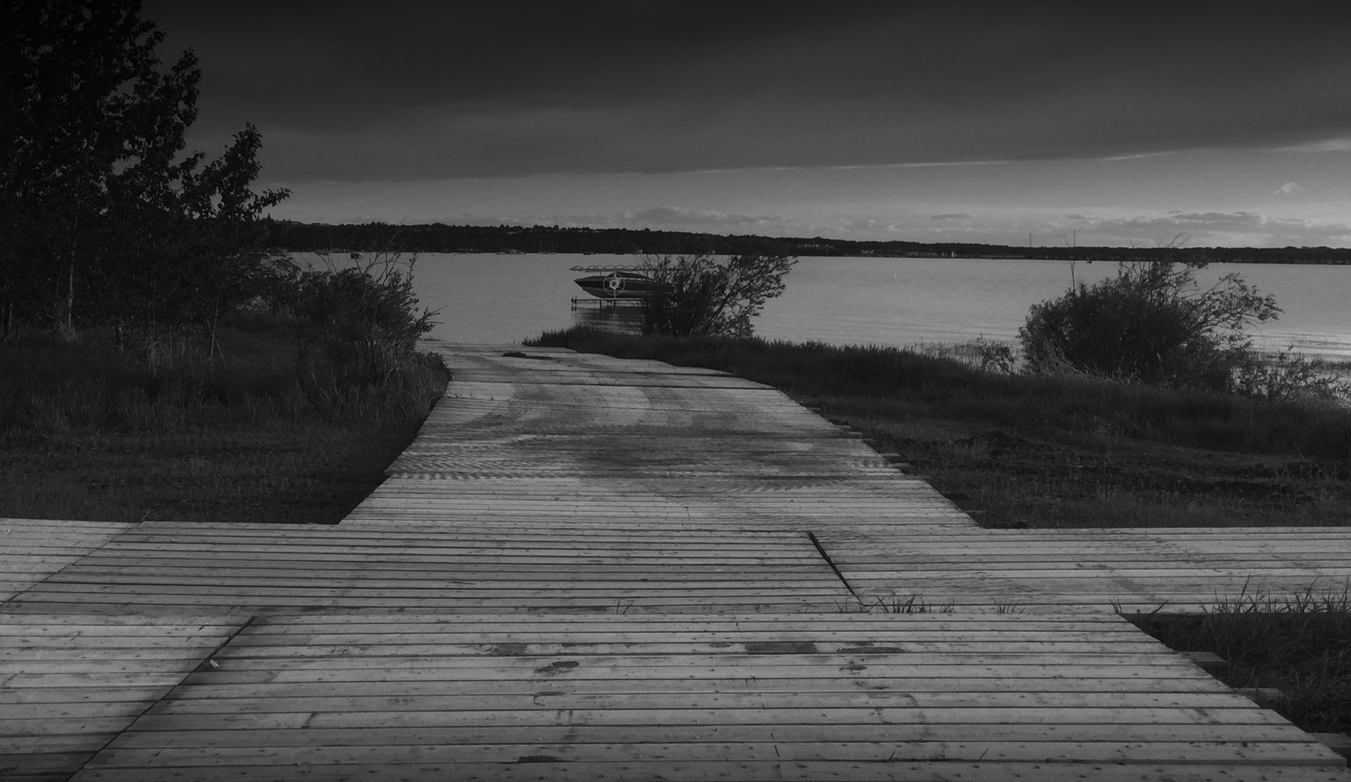 Access mats from MLC Access Solutions, leading down to a boat dock in Alberta, Canada.